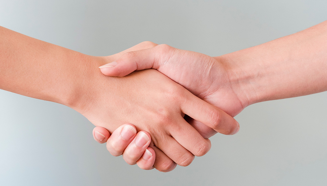 Patient shaking hands with a mental health provider