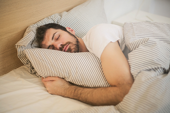 Man in bed getting restful sleep
